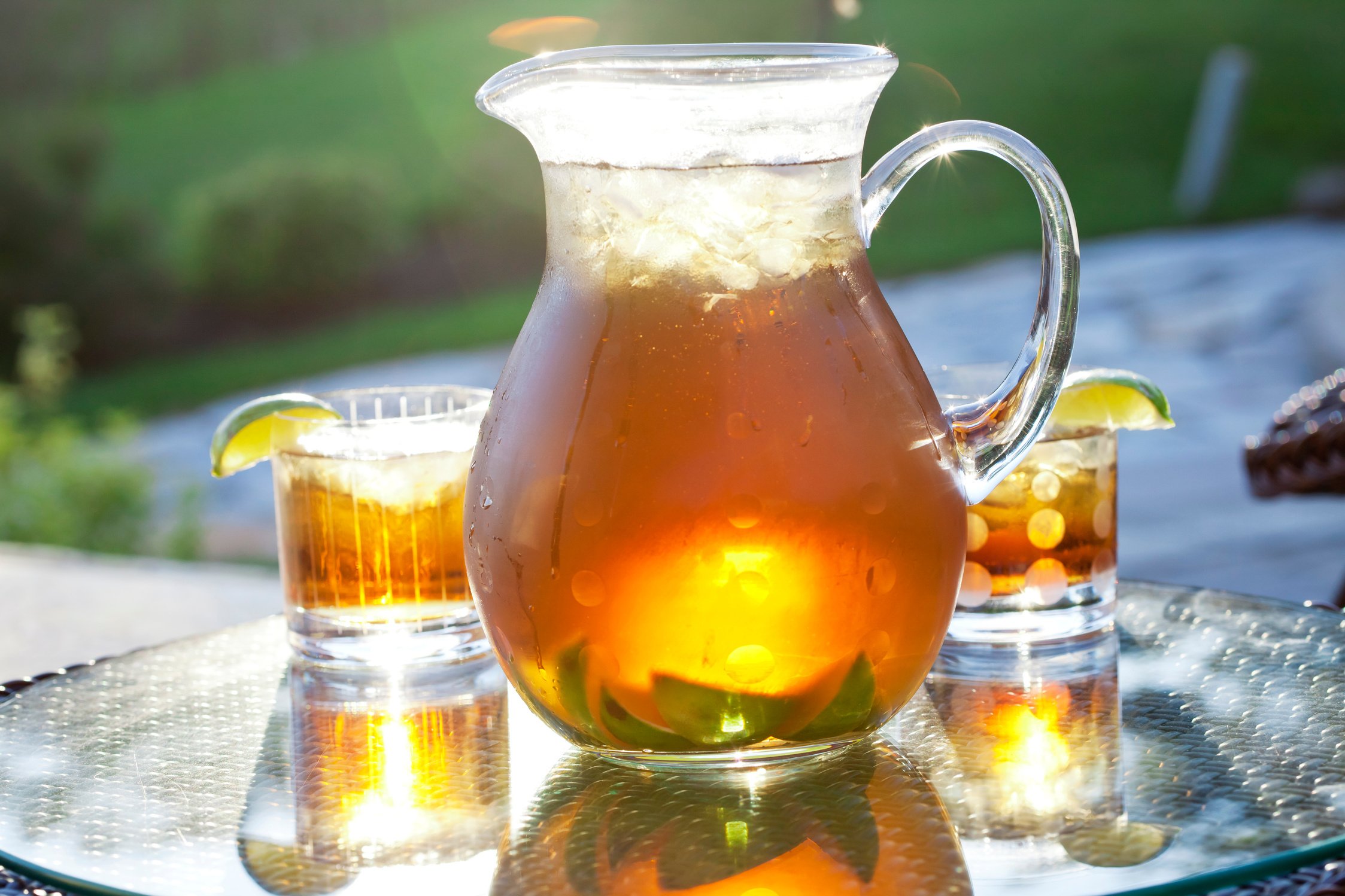 Pitcher of refreshing ice tea with lime.